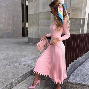 Pink long sleeve dress with frill hem.